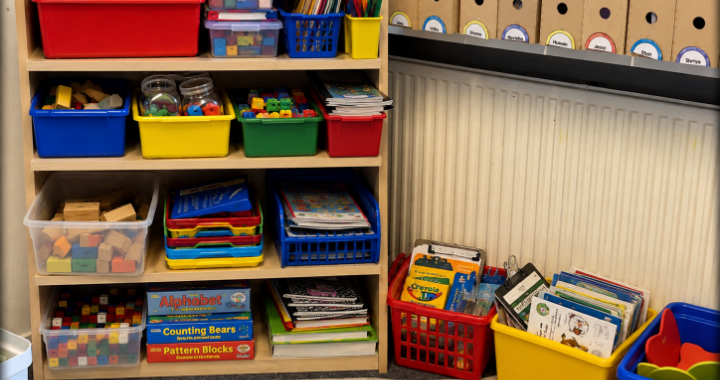 Learning resources stored in an assortment of brightly coloured plastic storage boxes
